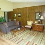 Great living area features a brick fireplace & laminate flooring